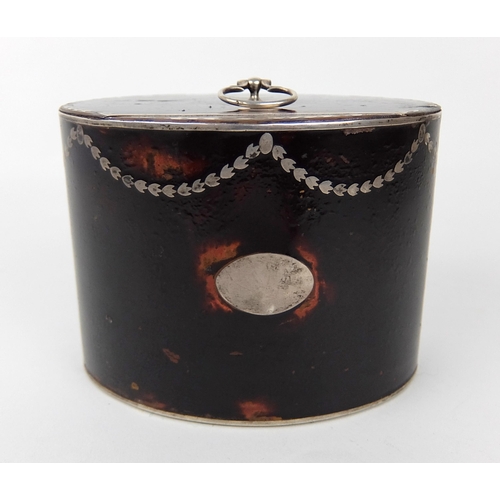 184A - A faux tortoiseshell tea caddy of oval shape