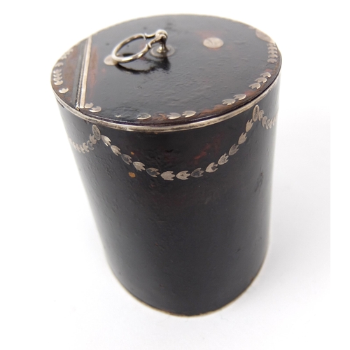 184A - A faux tortoiseshell tea caddy of oval shape