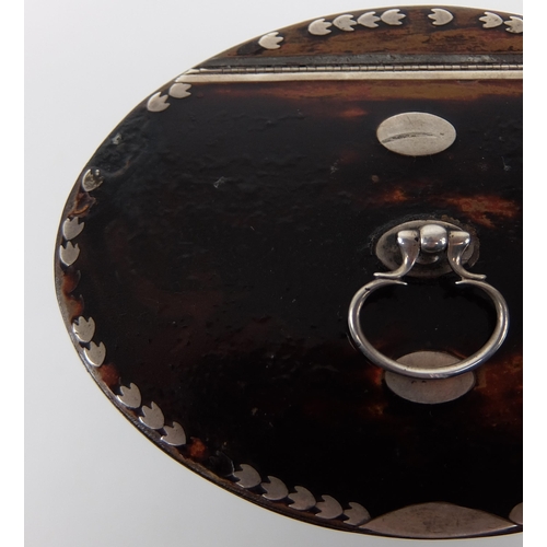 184A - A faux tortoiseshell tea caddy of oval shape