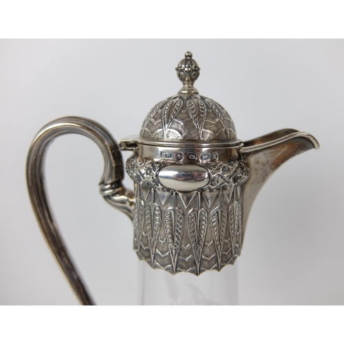 198 - A Victorian silver mounted claret jug