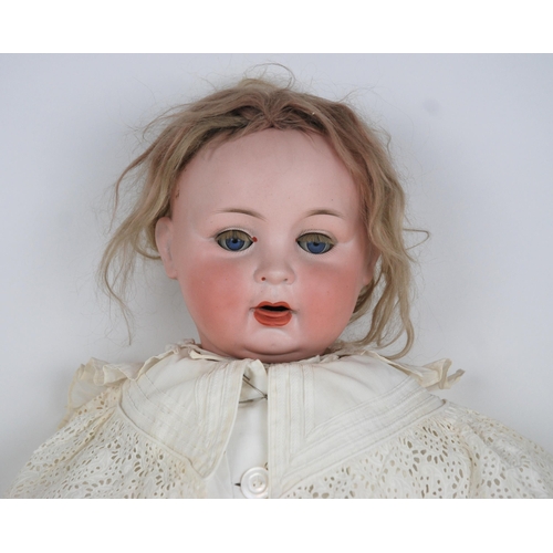 233 - A large bisque-head doll