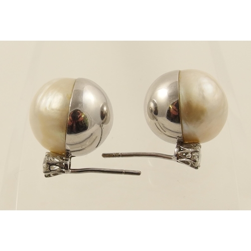 26 - A pair of substantial mabe pearl and diamond earrings