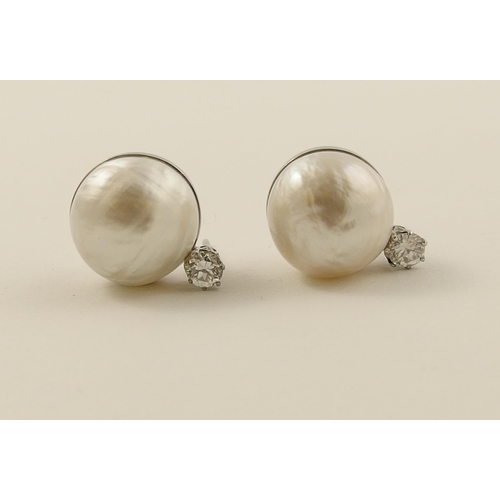 26 - A pair of substantial mabe pearl and diamond earrings