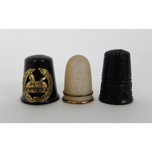 263 - A group of thimbles comprising;