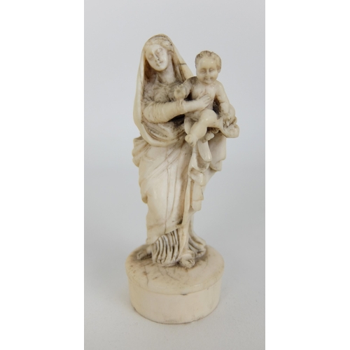 265 - A French ivory carving of The Madonna and child