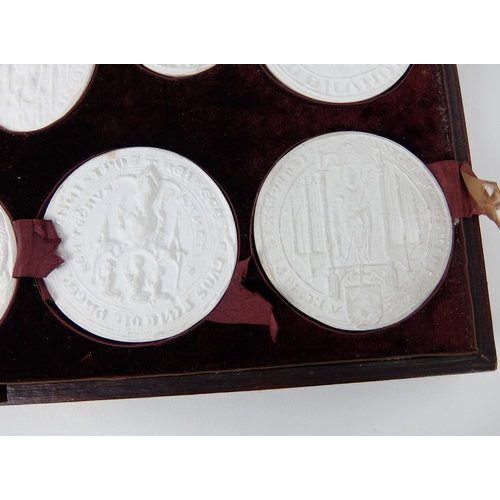 290 - A set of fifteen plaster of Paris oval and circular City of Glasgow seals