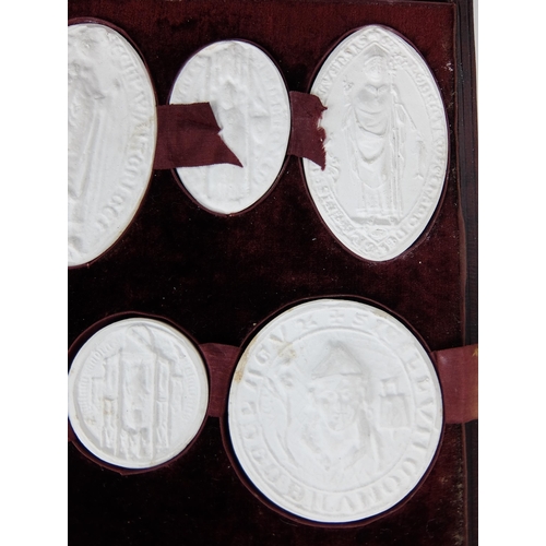 290 - A set of fifteen plaster of Paris oval and circular City of Glasgow seals