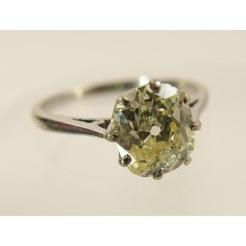 30 - A pale lemon solitaire diamond ring