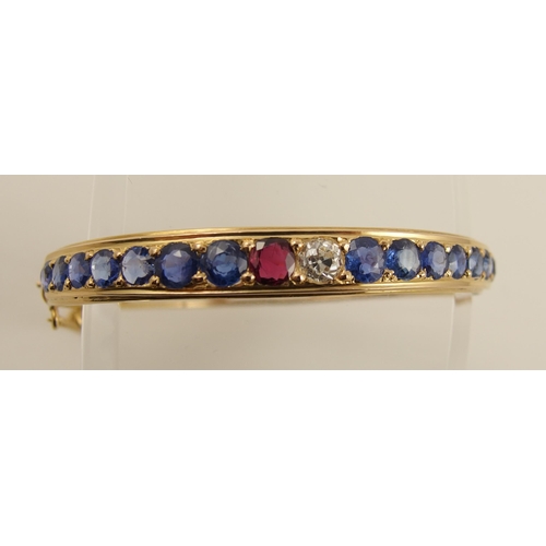 38 - A sapphire ruby and diamond bangle