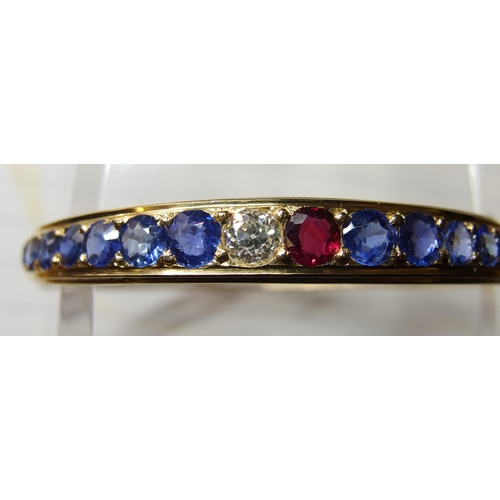 38 - A sapphire ruby and diamond bangle