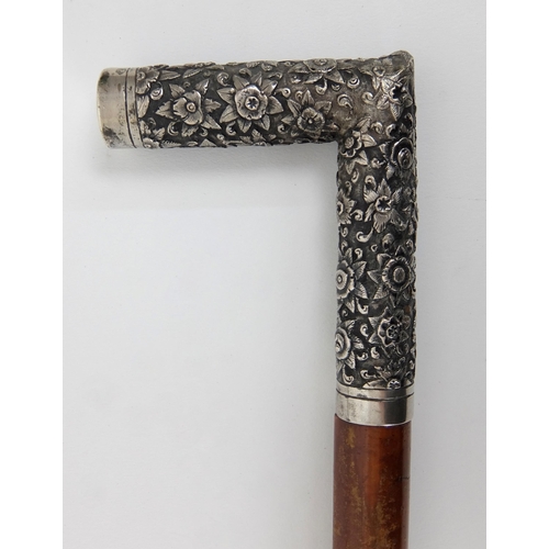 525 - A Chinese silver cane handle