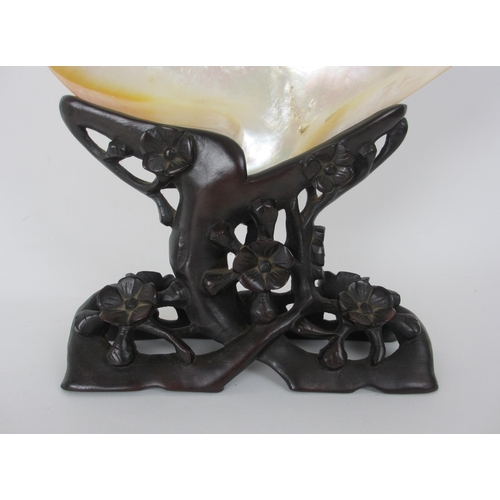 528 - A pair of Chinese carved wood stands