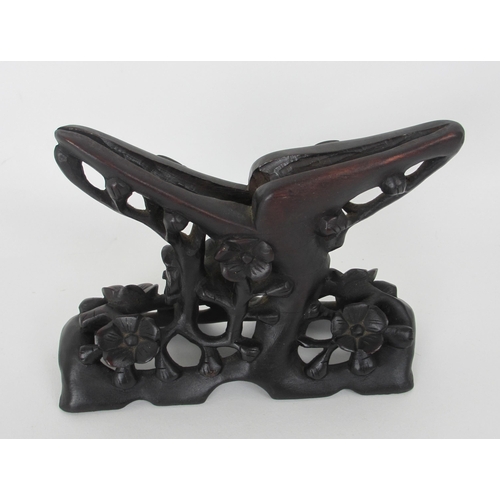 528 - A pair of Chinese carved wood stands