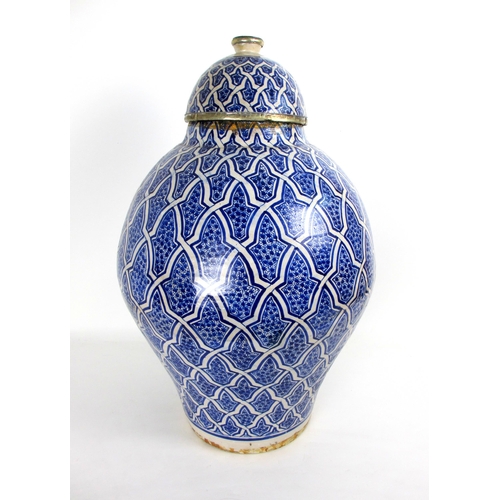 538 - A Persian blue and white baluster vase and cover