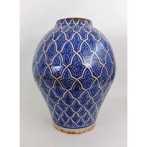 538 - A Persian blue and white baluster vase and cover