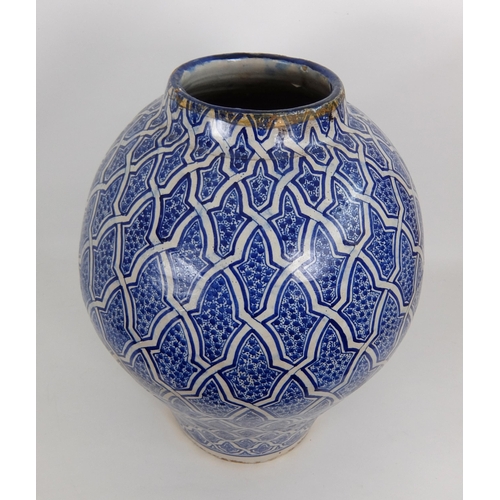 538 - A Persian blue and white baluster vase and cover