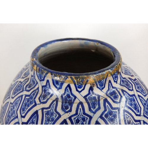 538 - A Persian blue and white baluster vase and cover