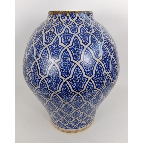 538 - A Persian blue and white baluster vase and cover