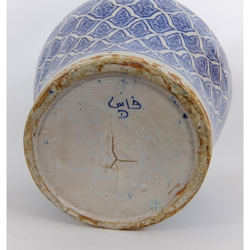 538 - A Persian blue and white baluster vase and cover