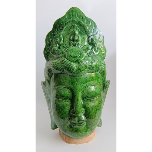 539 - A Chinese green glazed head of buddha