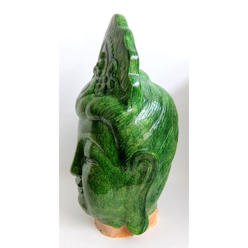 539 - A Chinese green glazed head of buddha