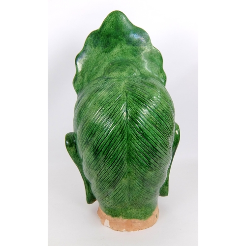 539 - A Chinese green glazed head of buddha