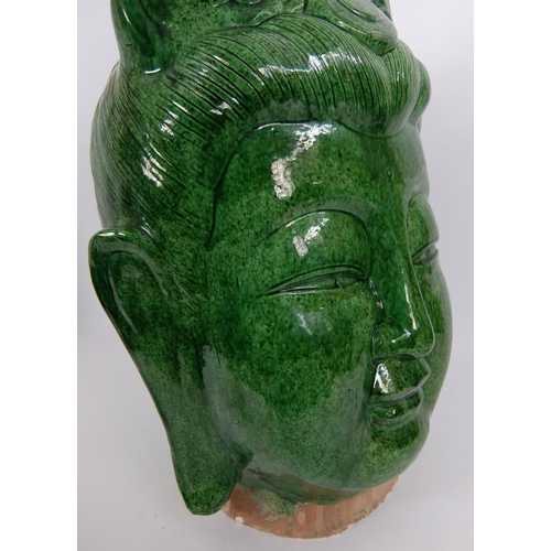 539 - A Chinese green glazed head of buddha