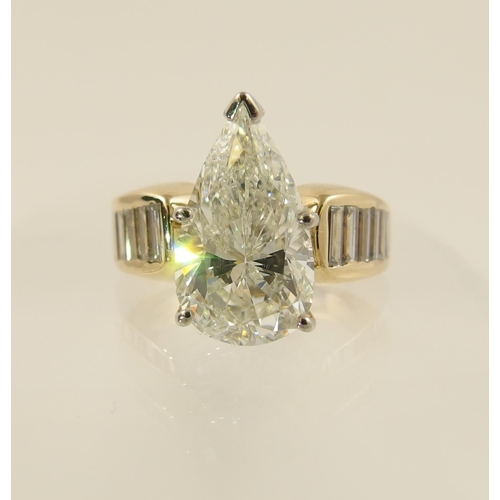 54 - A 6.79ct pear shaped brilliant cut diamond ring