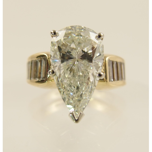 54 - A 6.79ct pear shaped brilliant cut diamond ring