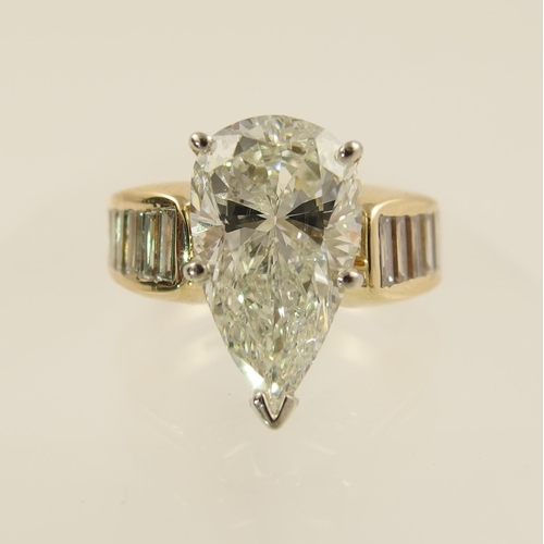 54 - A 6.79ct pear shaped brilliant cut diamond ring