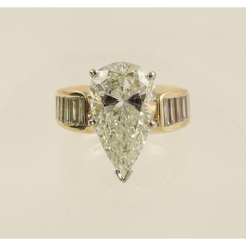 54 - A 6.79ct pear shaped brilliant cut diamond ring