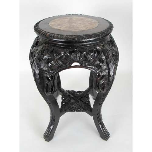 547A - A Chinese rosewood and marble inset plant pedestal