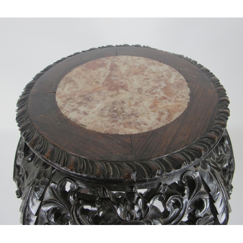 547A - A Chinese rosewood and marble inset plant pedestal