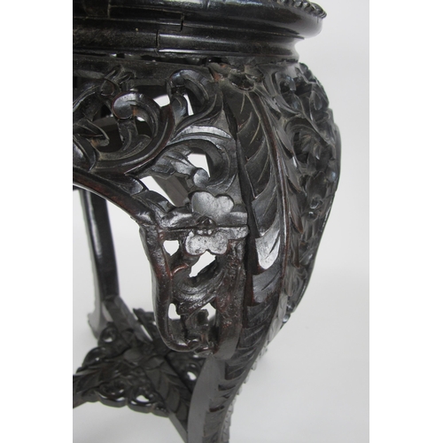 547A - A Chinese rosewood and marble inset plant pedestal