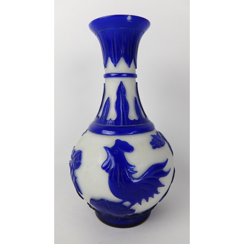 548D - A Chinese blue overlaid cut glass vase