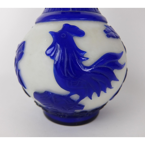 548D - A Chinese blue overlaid cut glass vase