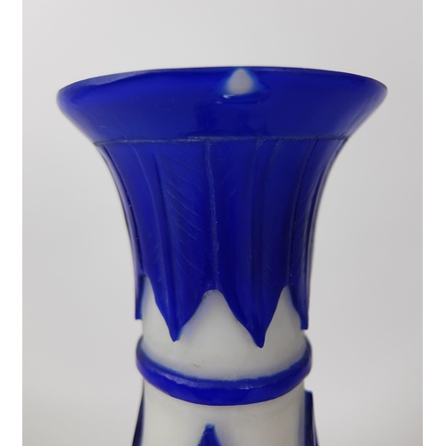 548D - A Chinese blue overlaid cut glass vase