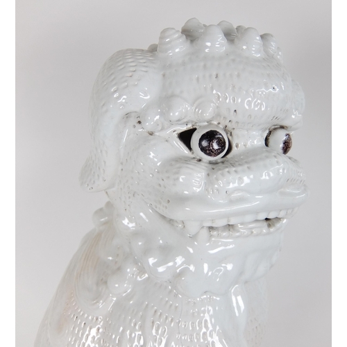 548F - A Chinese white glazed temple guardian