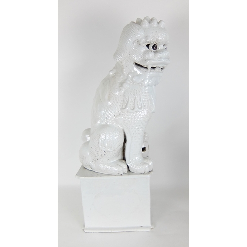 548F - A Chinese white glazed temple guardian