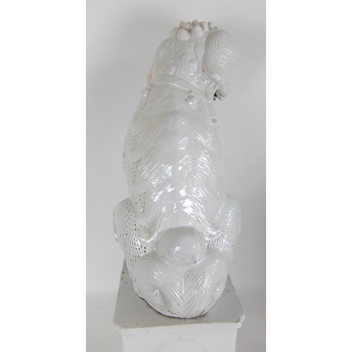 548F - A Chinese white glazed temple guardian