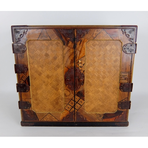 550A - A Japanese lacquered and marquetry table cabinet