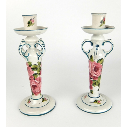 553 - A pair of Wemyss Ware Kintore candlesticks