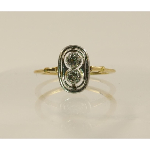 56 - An Edwardian twin diamond ring