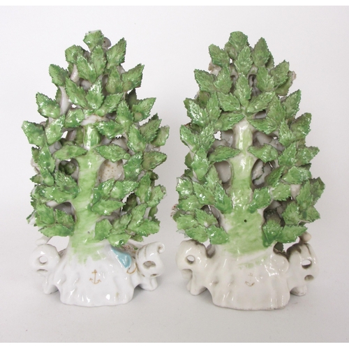 654 - A pair of Derby rococo moulded candlesticks