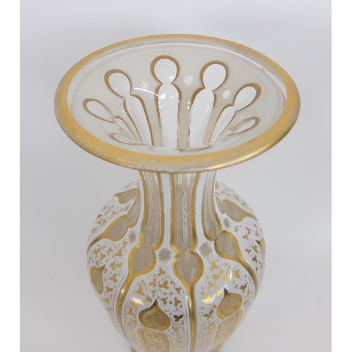 656 - A Bohemian Persian design opaque overlaid glass faceted vase