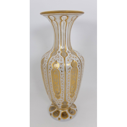 656 - A Bohemian Persian design opaque overlaid glass faceted vase