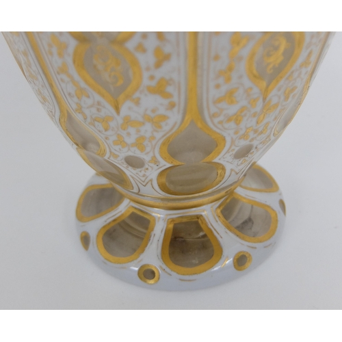 656 - A Bohemian Persian design opaque overlaid glass faceted vase