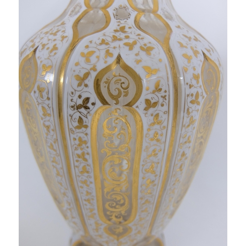 656 - A Bohemian Persian design opaque overlaid glass faceted vase