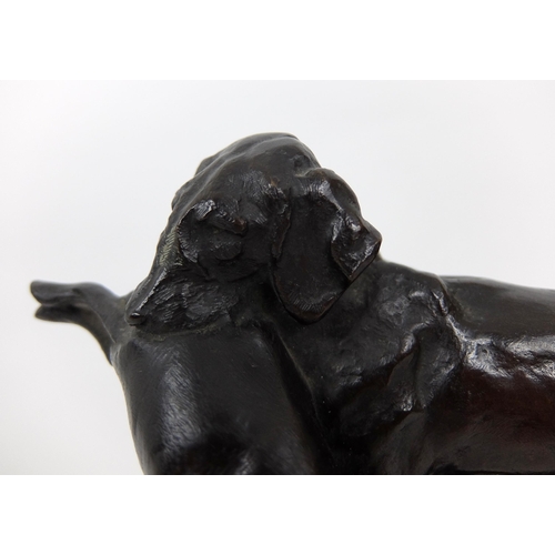 658 - A bronze of a hound with hare grasped in its mouth