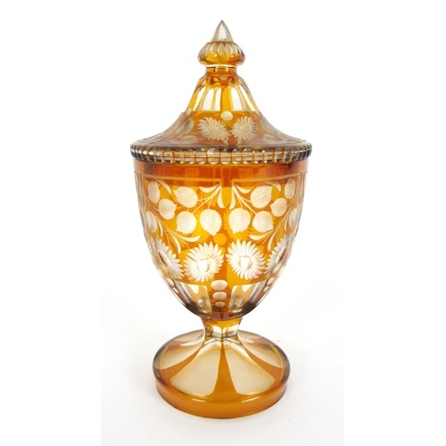 671 - A Bohemian amber flash and cut glass vase and cover